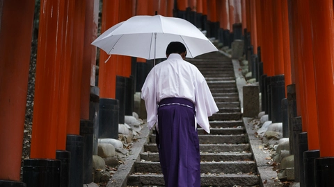 Shinto priest at Fushimi Inari Shrine, Kyoto, Japan.